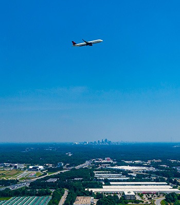 Image of Delta plane flying over Atlanta