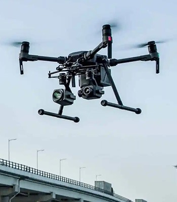 Image of drone inspecting a bridge