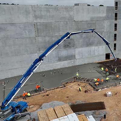 Concrete pump pumping a slab