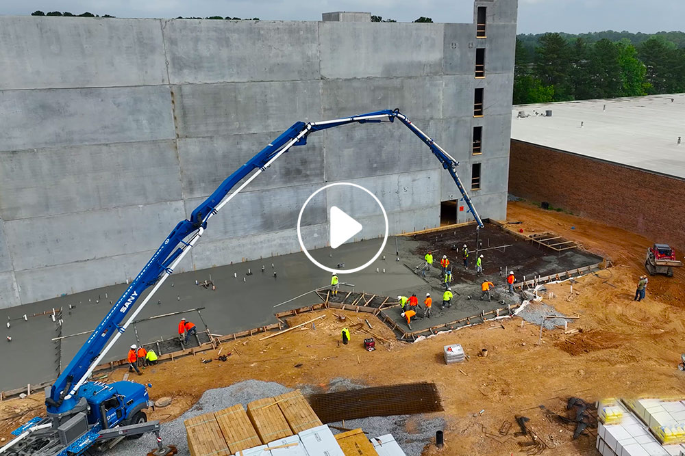 Concrete pump pumping concrete